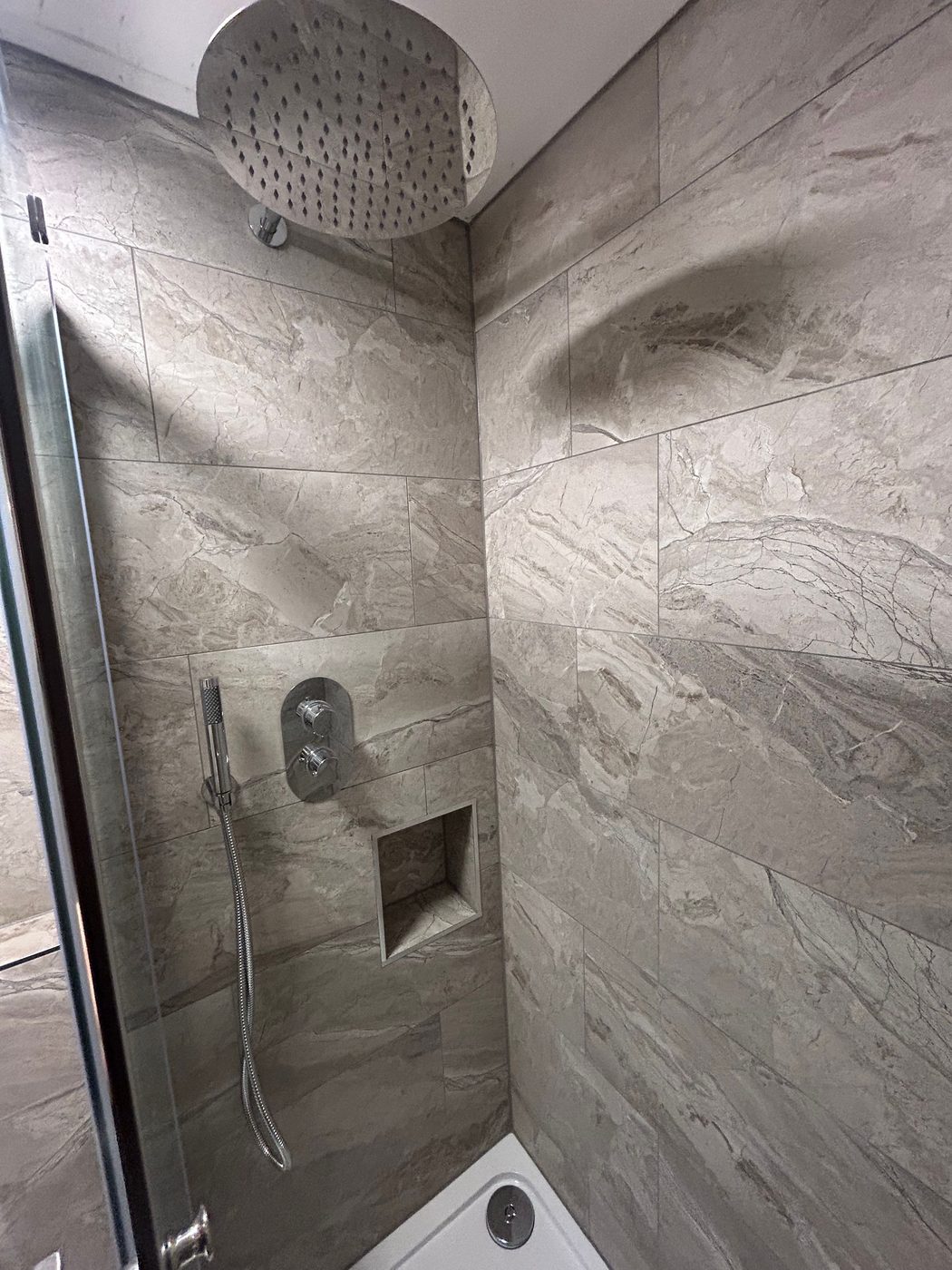 Rainfall shower installation with tiled walls by K3 Gas Group